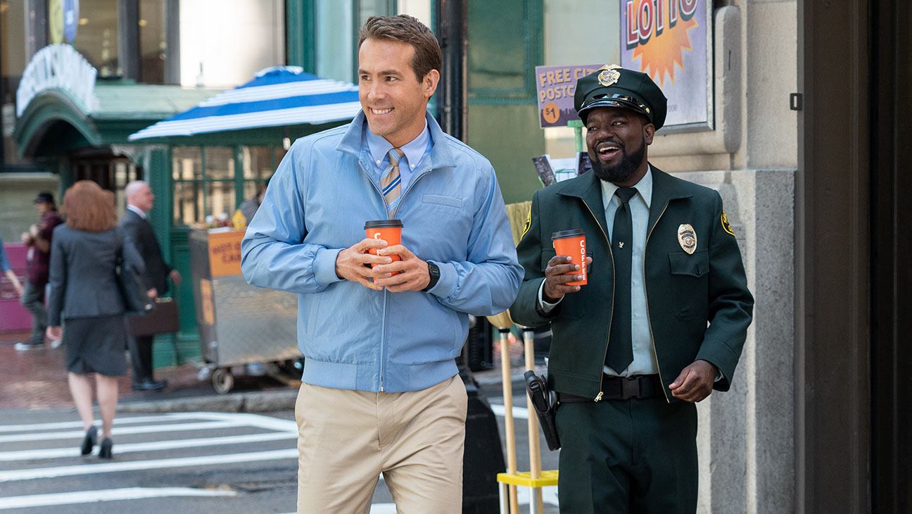 Ryan Reynolds as Guy and Lil Rel Howery as Buddy in 20th Century Studios’ FREE GUY.